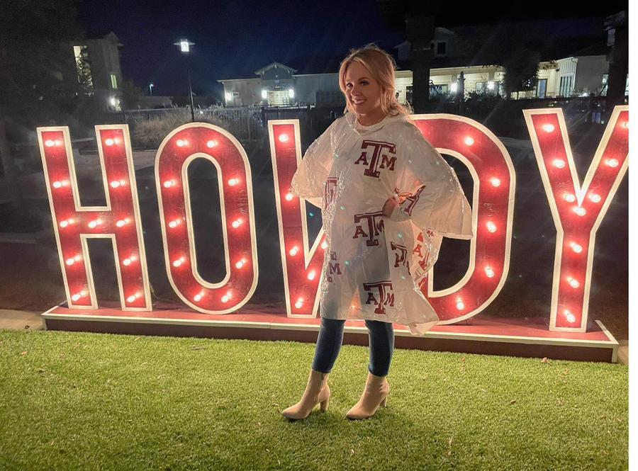 HOWDY marquee letters glowing at an outdoor event